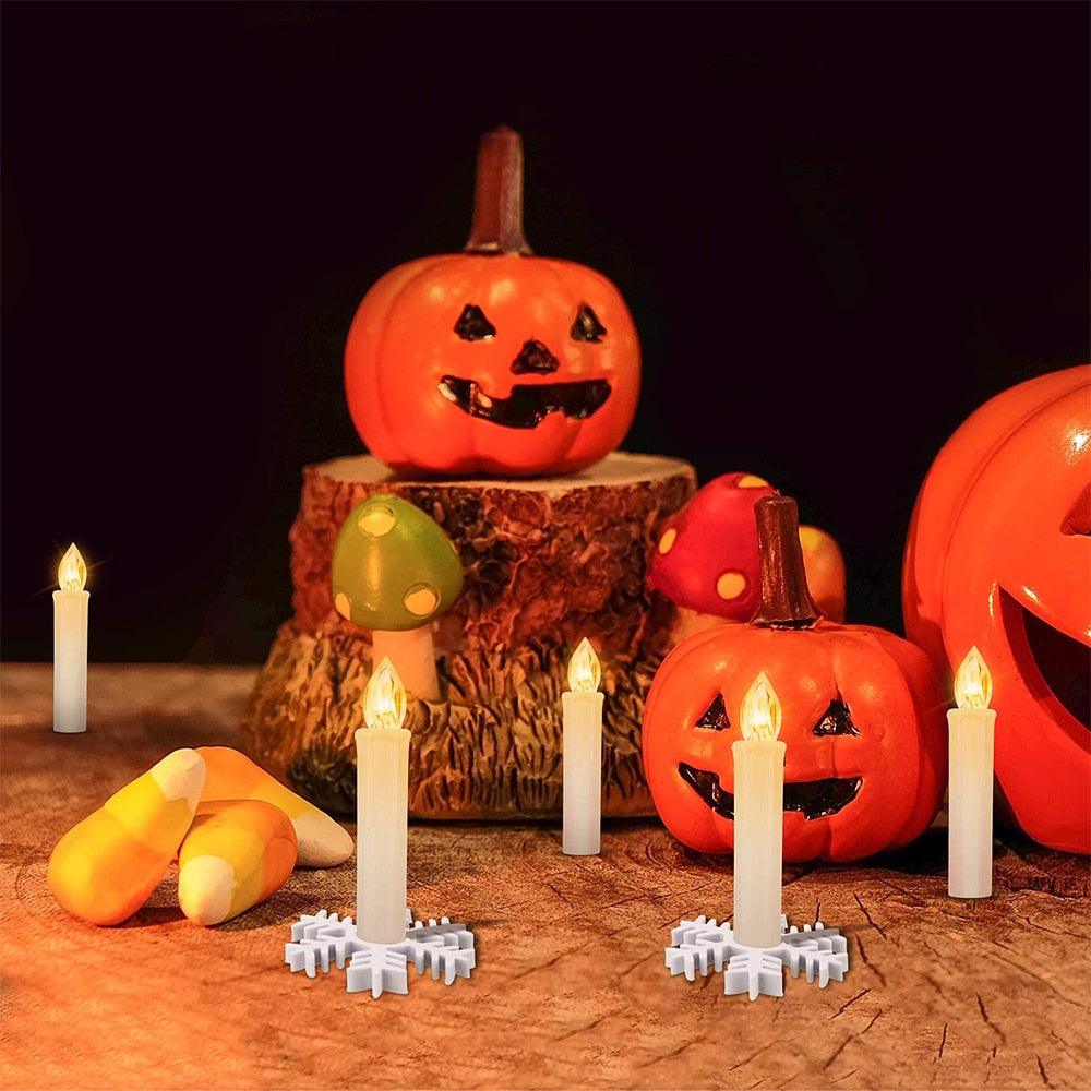 Stevvex flameless taper LED candles with warm white light on snowflake bases amid pumpkins on Tampa Home & Garden Store