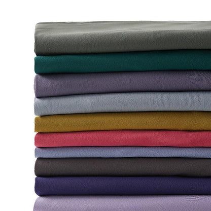 Stevvex women's yoga leggings fabric swatches in stacked colorful folds on Tampa Home & Garden Store