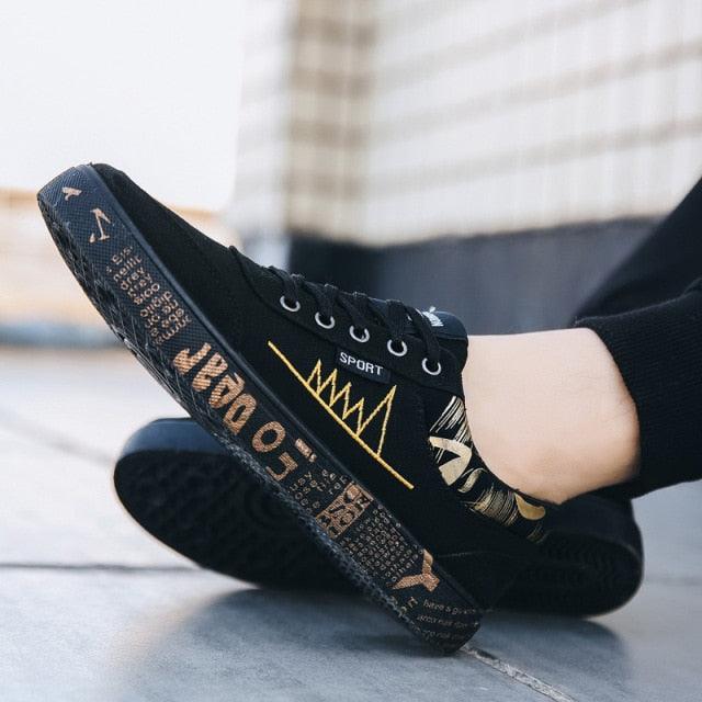 Stevvex men's black canvas sneakers with gold graphic accents, low-top lace-up walking shoes on Tampa Home & Garden Store