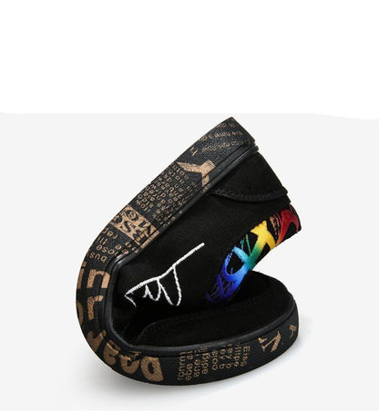Mens black canvas sneakers with rainbow graphic accents, casual low-top walking flats on Tampa Home & Garden Store
