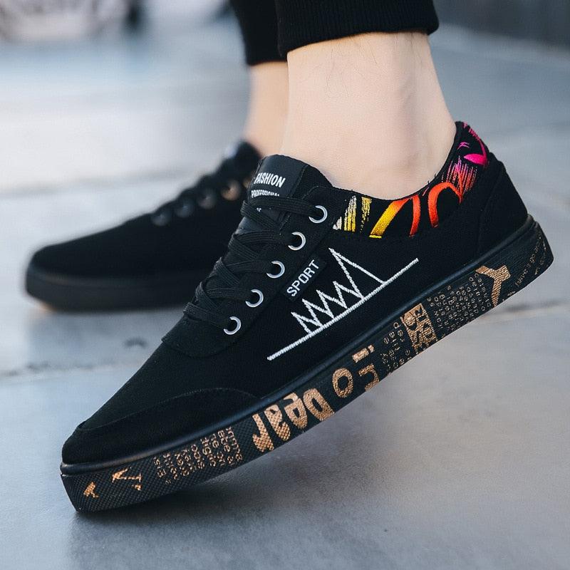 Stevvex black canvas sneakers, lace-up low-top with multicolor heel accent and graphic sole on Tampa Home & Garden Store