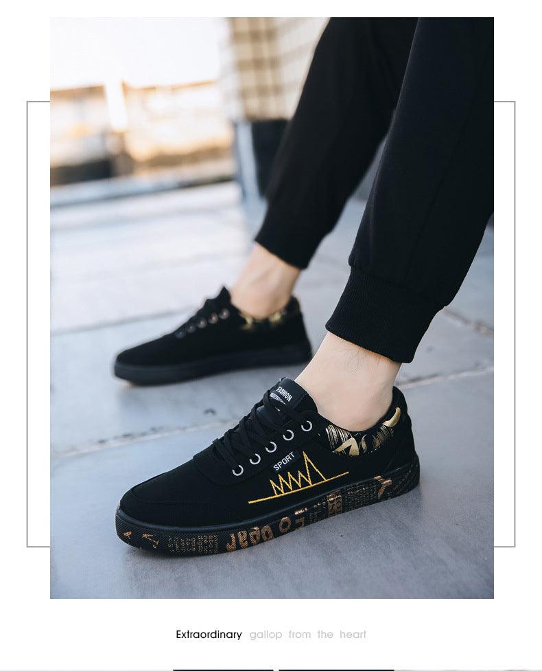 Stevvex men's black canvas sneakers with gold side graphic and lace-up closure on a model on Tampa Home & Garden Store