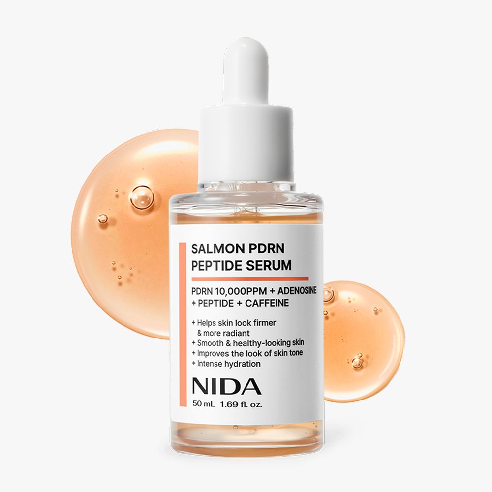 NIDA Salmon PDRN Peptide Serum bottle with dropper, 50 ml, orange serum splash backdrop on Tampa Home & Garden Store