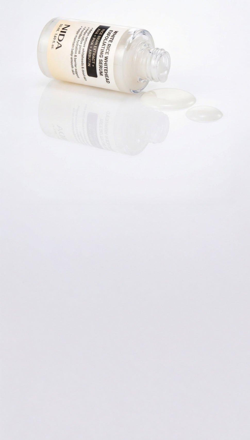 NIDA White Rice Whitehead Exfoliating Serum bottle with white serum droplets, 50ml on Tampa Home & Garden Store