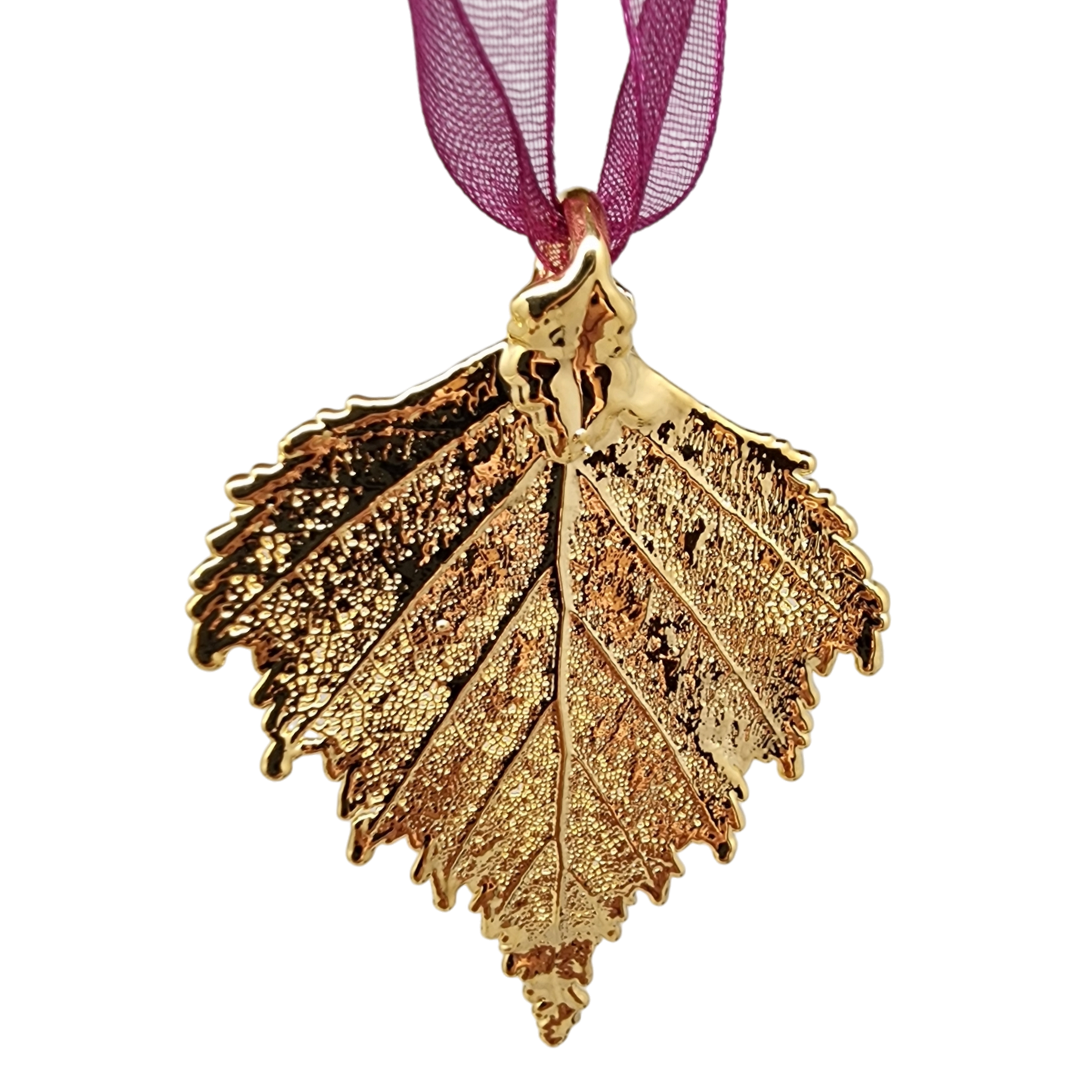 Ornement en feuille de bouleau dorée avec ruban transparent