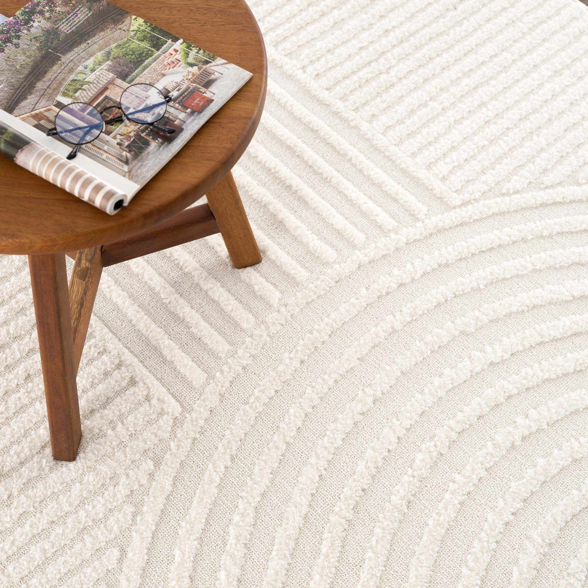 Guiling 3D Rainbow Area Rug with Tassels beige textured rug under a wooden coffee table Boutique Rugs on Tampa Home & Garden Store
