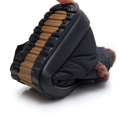 Stevvex non-slip snow boots with black waterproof upper and tan outsole, warm faux fur lining on Tampa Home & Garden Store