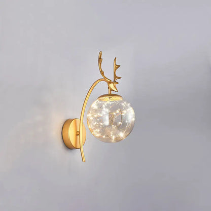 Decorbites gold antler wall sconce with glass globe and warm fairy lights on Tampa Home & Garden Store