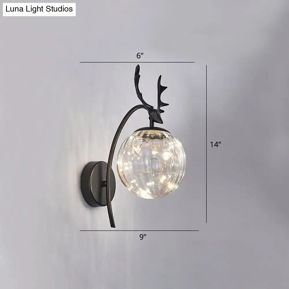 Black Antler Wall Sconce by Decorbites with black metal frame and clear glass globe on Tampa Home & Garden Store
