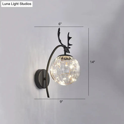 Black Antler Wall Sconce by Decorbites with black metal frame and clear glass globe on Tampa Home & Garden Store
