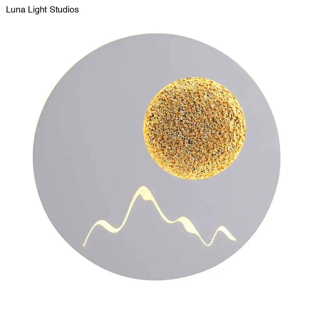 Metallic Mountain Wall Light by Decorbites, gold sun on gray plate and mountain ridge on Tampa Home & Garden Store