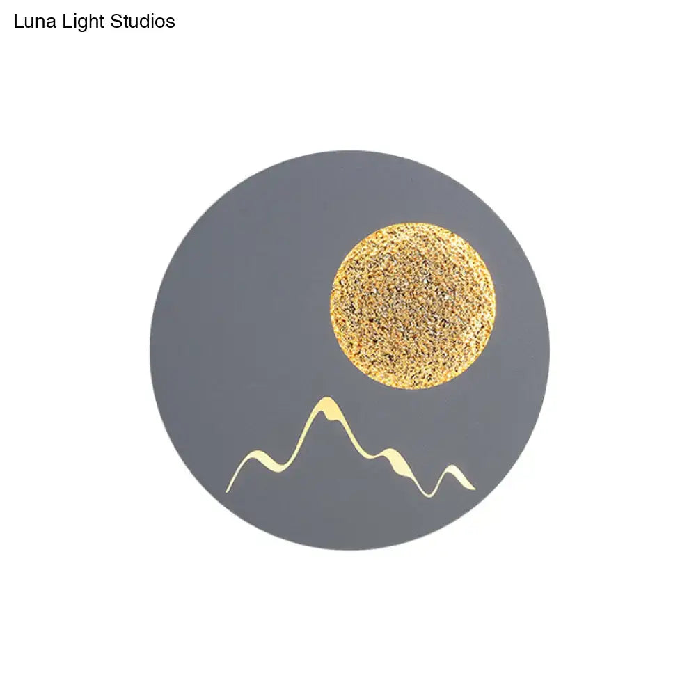 Metallic Mountain Wall Light by Decorbites, gray disc with gold sun and mountain motif on Tampa Home & Garden Store
