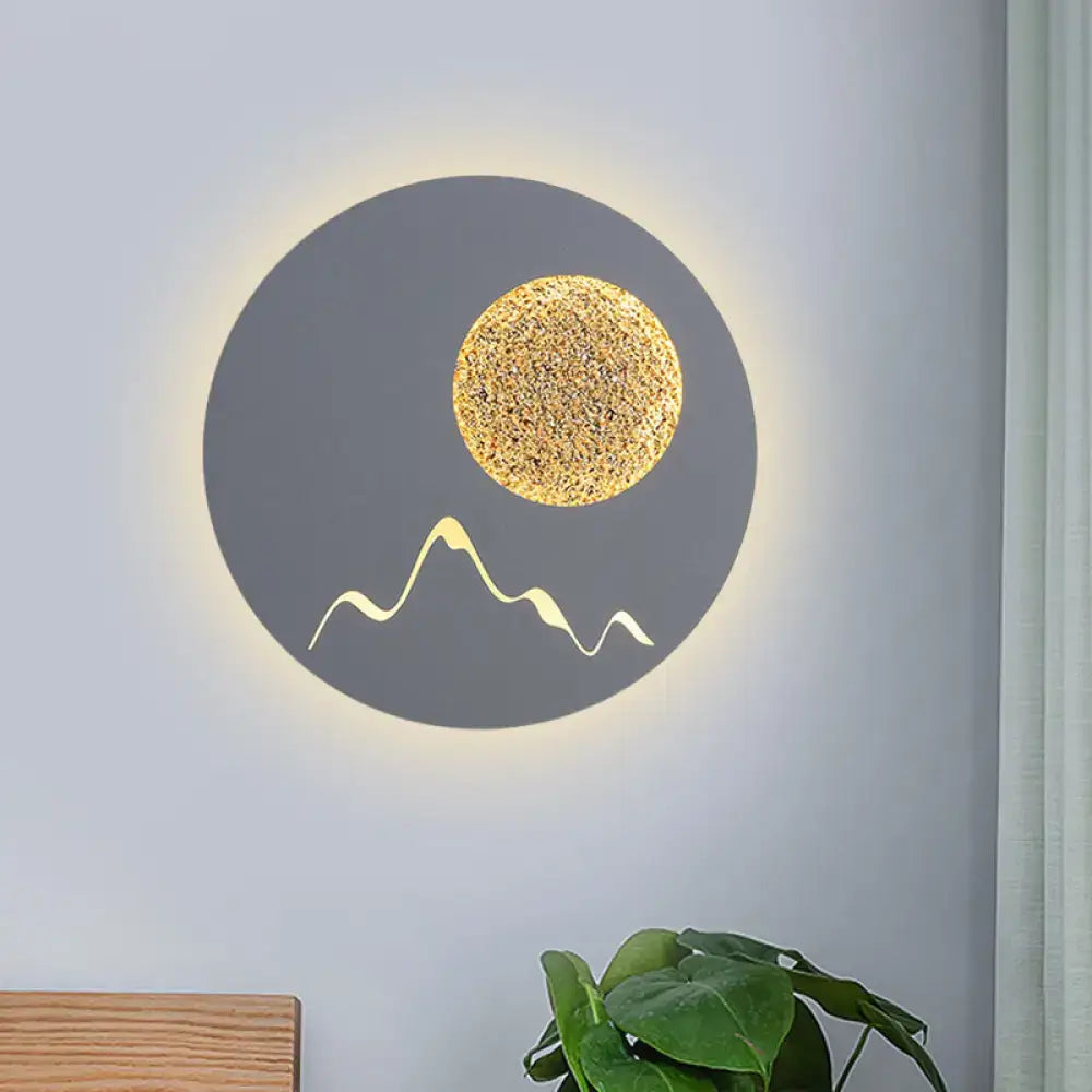 Metallic Mountain Wall Light by Decorbites, gray sconce with gold moon and mountain line, glow on Tampa Home & Garden Store