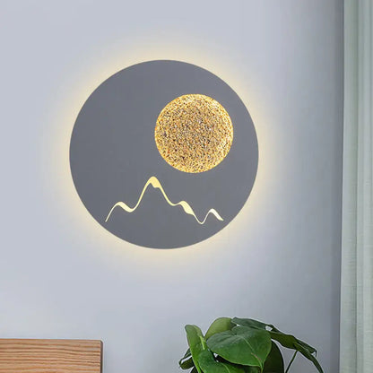 Metallic Mountain Wall Light by Decorbites, gray sconce with gold moon and mountain line, glow on Tampa Home & Garden Store
