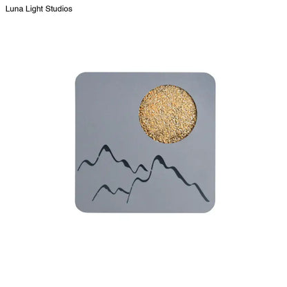 Metallic Mountain Wall Light with gold sun and black mountain silhouettes on gray panel on Tampa Home & Garden Store
