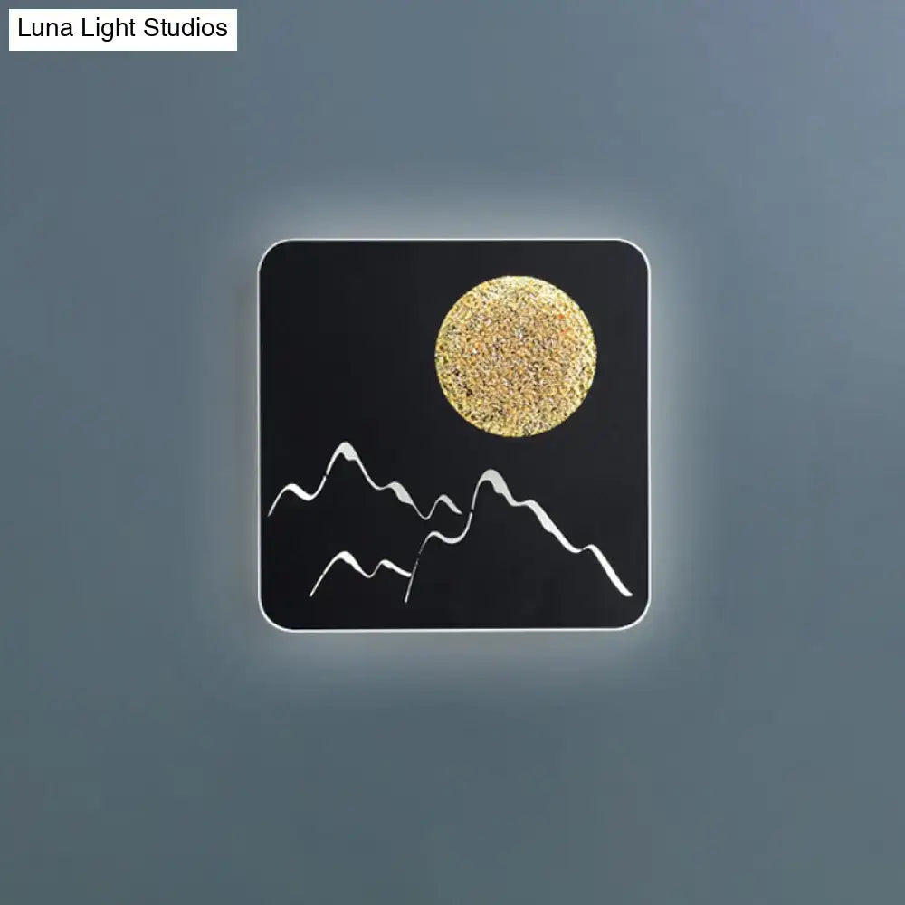 Decorbites Metallic Mountain Wall Light black square sconce with gold sun and mountains on Tampa Home & Garden Store