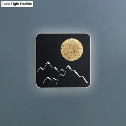 Decorbites Metallic Mountain Wall Light black square sconce with gold sun and mountains on Tampa Home & Garden Store