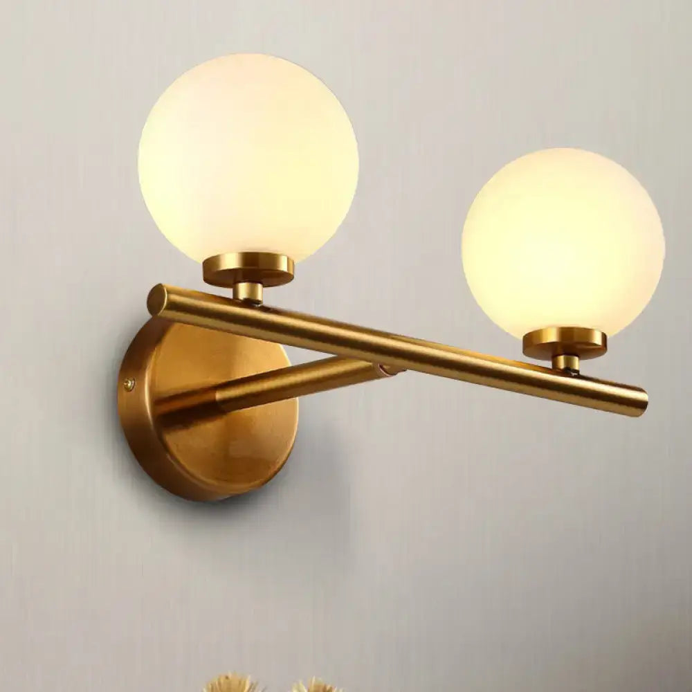 Brass Globe Compact Wall Sconce with two frosted globes Decorbites on Tampa Home & Garden Store