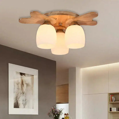 Decorbites Cream Glass Bell Ceiling Light with 3 cream glass shades on a wood flush mount on Tampa Home & Garden Store