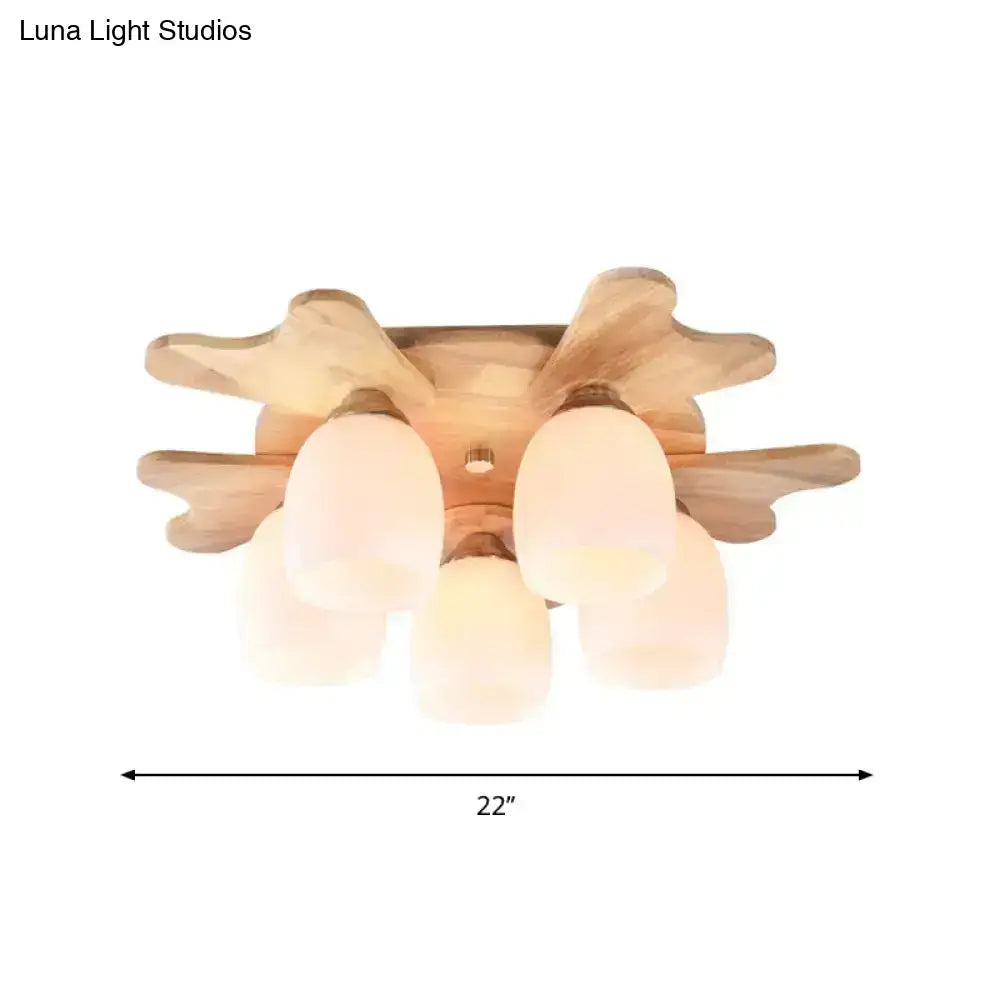 Cream Glass Bell Ceiling Light with a wooden starburst base and three frosted glass shades on Tampa Home & Garden Store