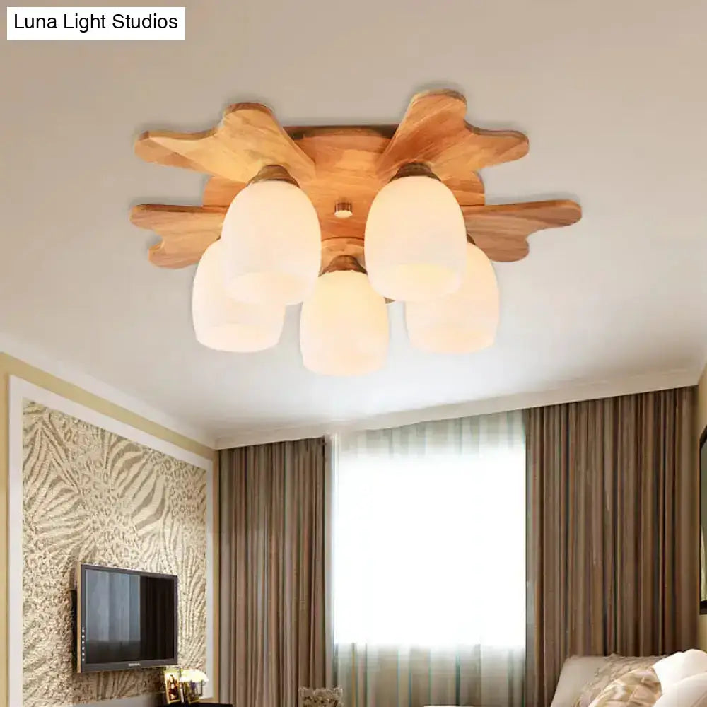 Cream glass bell ceiling light by Decorbites with wooden sunburst base, frosted shades, flush mount on Tampa Home & Garden Store