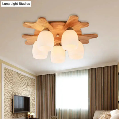 Cream glass bell ceiling light by Decorbites with wooden sunburst base, frosted shades, flush mount on Tampa Home & Garden Store