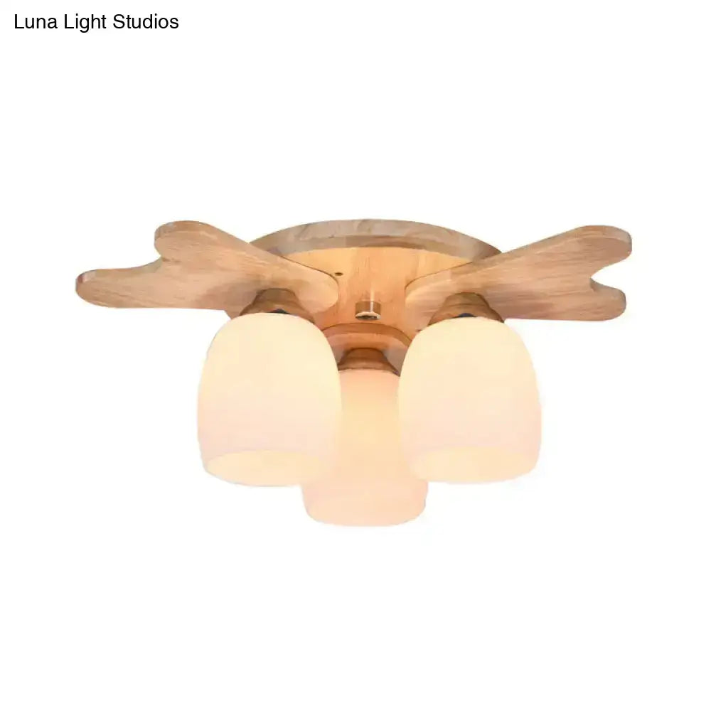 Cream glass bell ceiling light with three shades and wooden base flush mount on Tampa Home & Garden Store