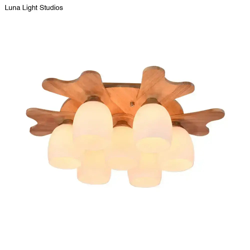 Cream glass bell flush mount light with wooden petal motif and globe cluster by Decorbites on Tampa Home & Garden Store
