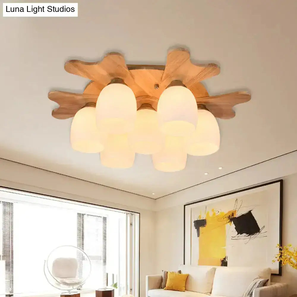 Cream glass bell ceiling light with wooden starburst mount and frosted shades by Decorbites on Tampa Home & Garden Store