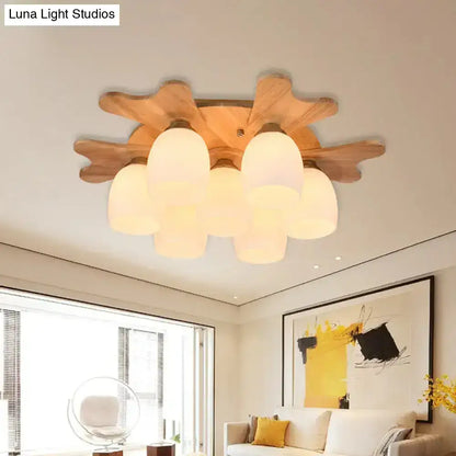 Cream glass bell ceiling light with wooden starburst mount and frosted shades by Decorbites on Tampa Home & Garden Store