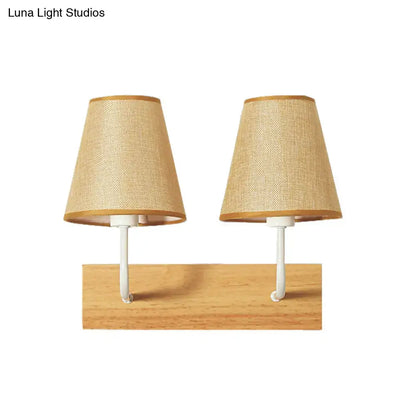 Flaxen Wood Wall Sconce pair with burlap lampshades on a natural wood base on Tampa Home & Garden Store