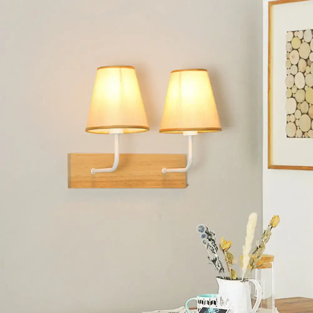 Flaxen Wood Wall Sconce by Decorbites with twin beige lampshades on a wooden backplate on Tampa Home & Garden Store