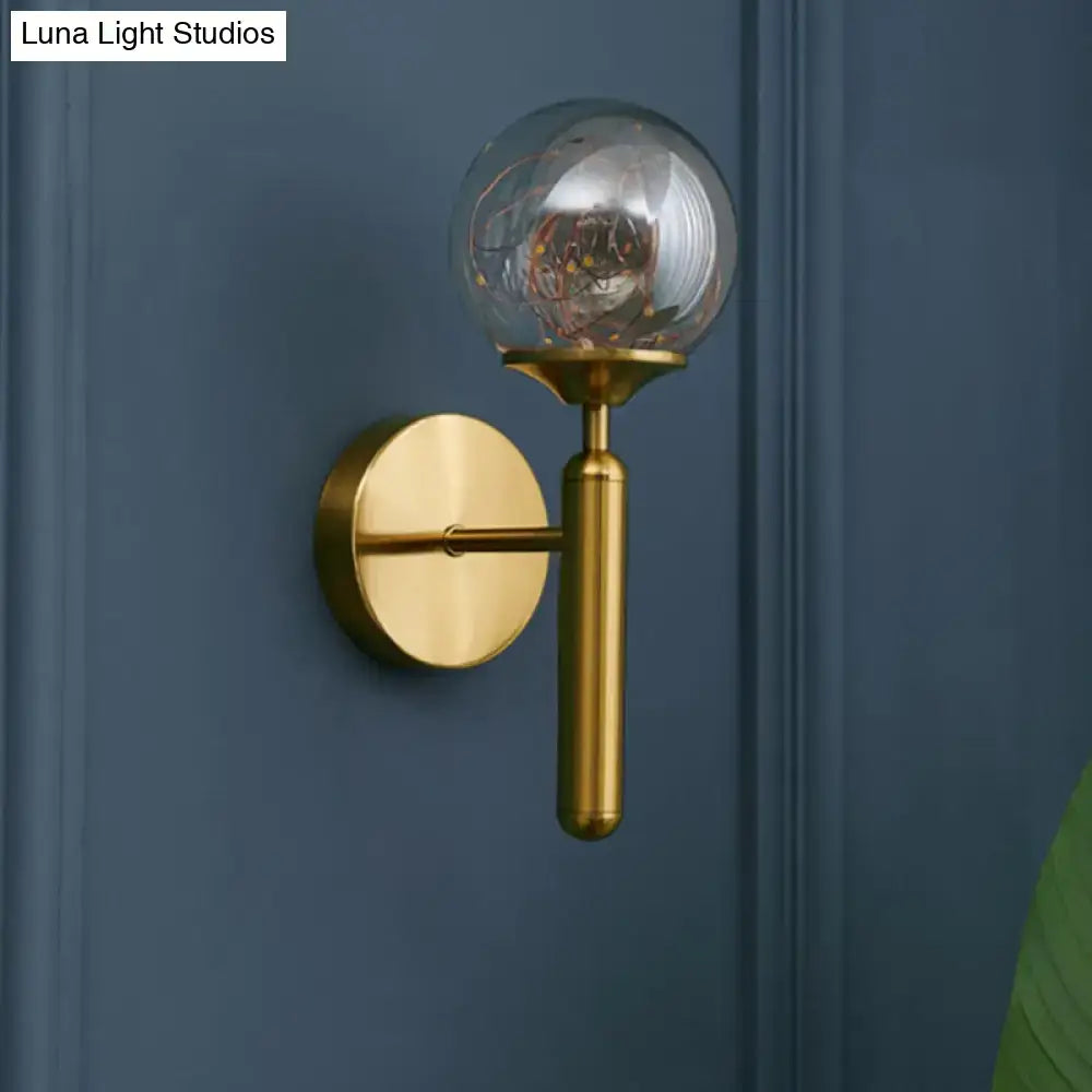 Gold glass globe wall sconce with brass finish by Decorbites, wall-mounted round backplate on Tampa Home & Garden Store