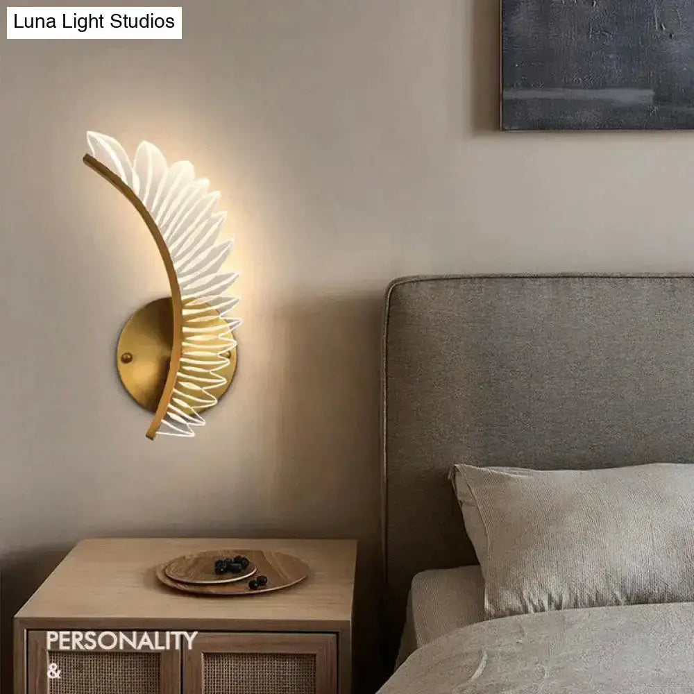 Nordic gold feather wall lamp sconce by Decorbites with white blades on brass circle in bedroom on Tampa Home & Garden Store