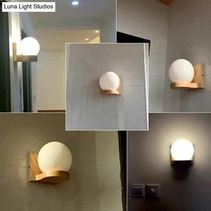 Decorbites Opal Glass Wood Sconce with round white glass globe and natural wood mount on Tampa Home & Garden Store