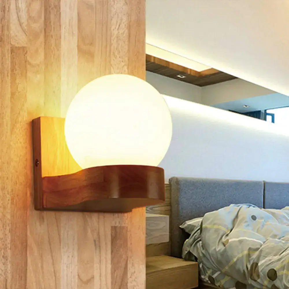 Opal Glass Wood Sconce by Decorbites with round frosted globe mounted on a curved wooden bracket on Tampa Home & Garden Store