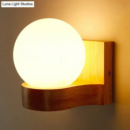 Opal glass wood sconce with round globe on a natural wood wall mount Decorbites on Tampa Home & Garden Store