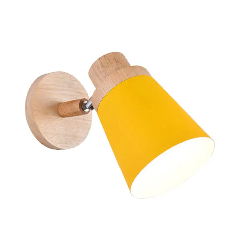 Gray wood coolie wall light by Decorbites with yellow shade mounted on round wooden base on Tampa Home & Garden Store