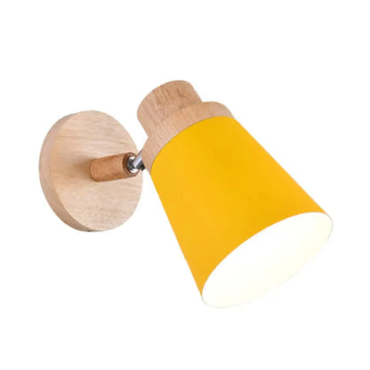 Gray wood coolie wall light by Decorbites with yellow shade mounted on round wooden base on Tampa Home & Garden Store