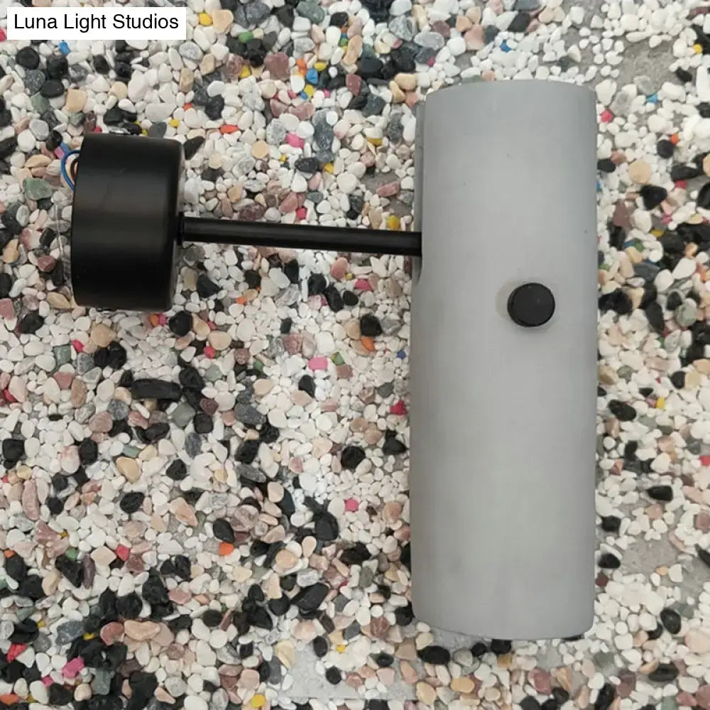 Matte black wall spotlight with grey cylindrical housing and black arm by Decorbites on Tampa Home & Garden Store