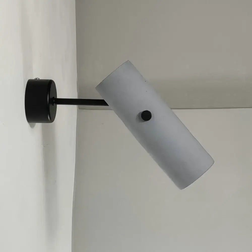 Matte black wall spotlight with gray cylindrical shade mounted on wall by Decorbites on Tampa Home & Garden Store