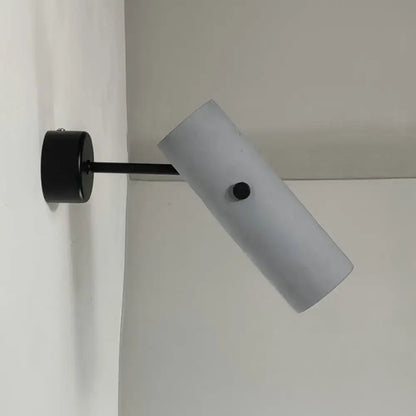 Matte black wall spotlight with gray cylindrical shade mounted on wall by Decorbites on Tampa Home & Garden Store
