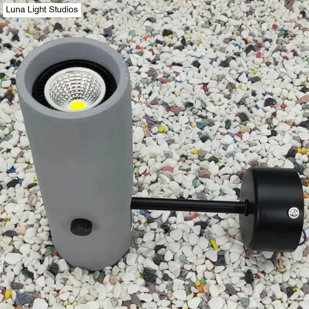 Matte Black Wall Spotlight outdoor light with cylindrical body and round wall mount on Tampa Home & Garden Store
