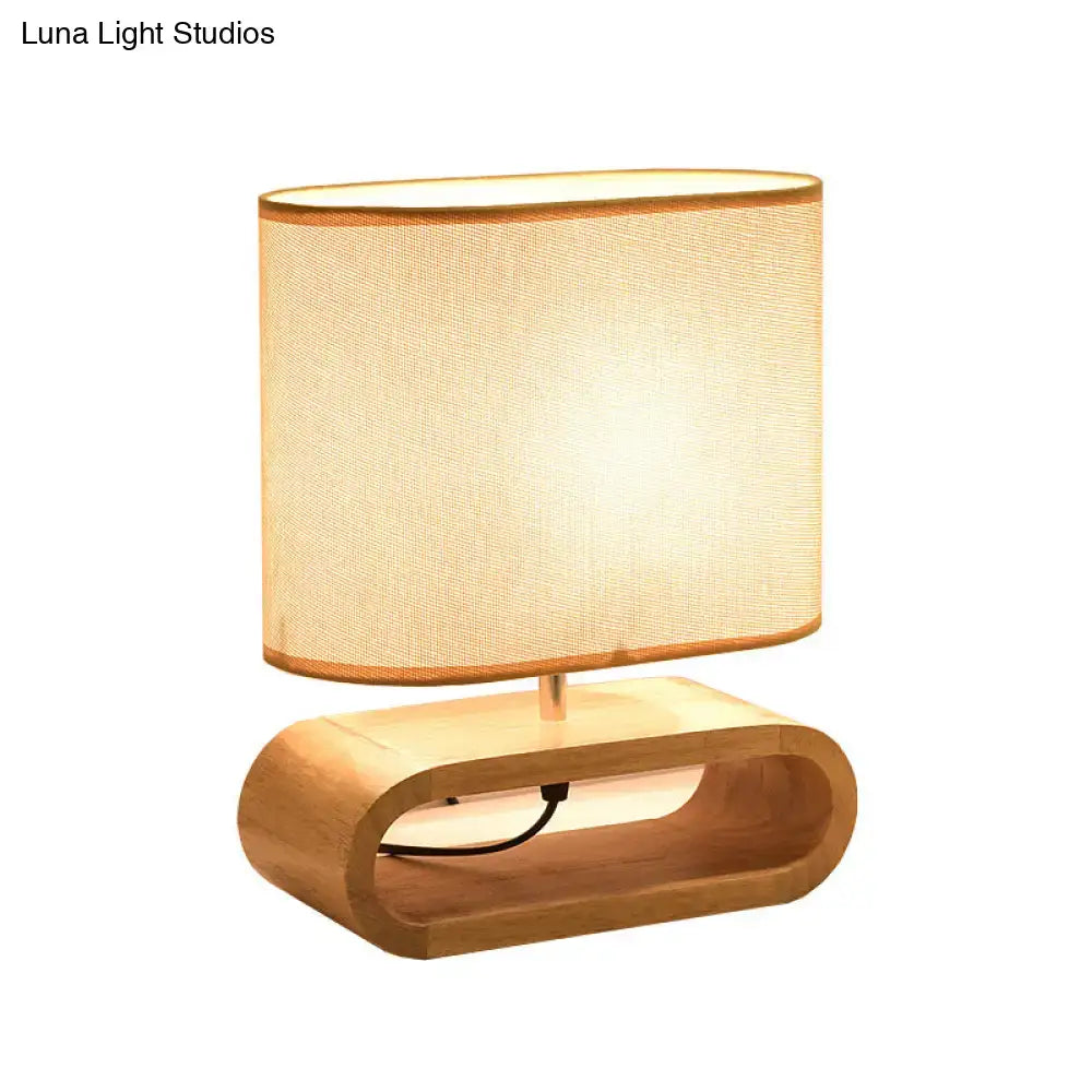 Wood Fabric Table Lamp by Decorbites with curved wooden base and beige fabric shade on Tampa Home & Garden Store