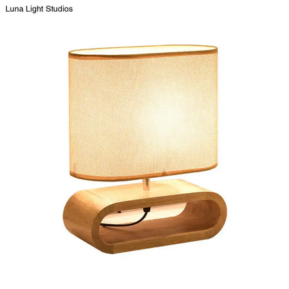 Wood Fabric Table Lamp by Decorbites with curved wooden base and beige fabric shade on Tampa Home & Garden Store