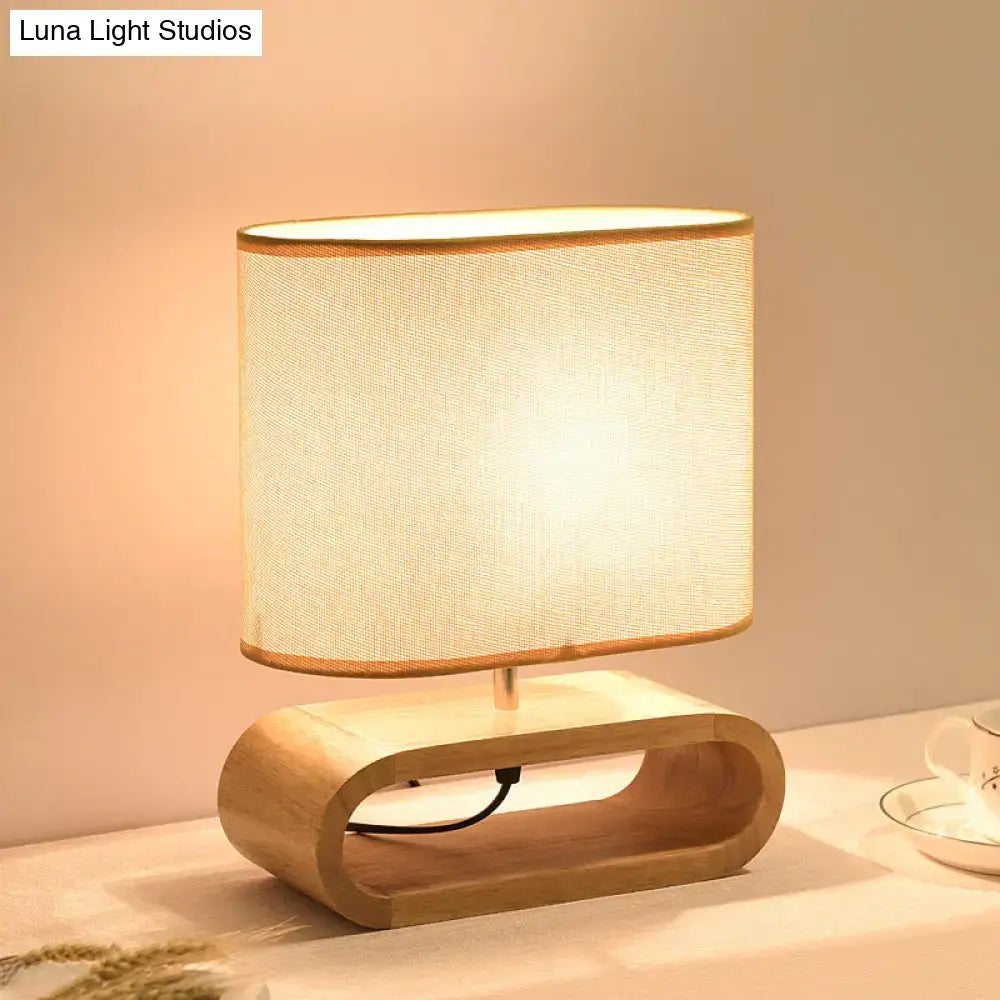 Wood Fabric Table Lamp Decorbites with curved wooden base and beige fabric shade on Tampa Home & Garden Store