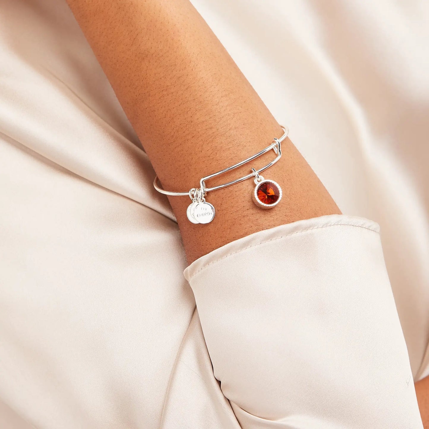 November Birthstone Charm Bangle Topaz, ALEX AND ANI silver-tone bracelet with orange topaz charm on wrist on Tampa Home & Garden Store