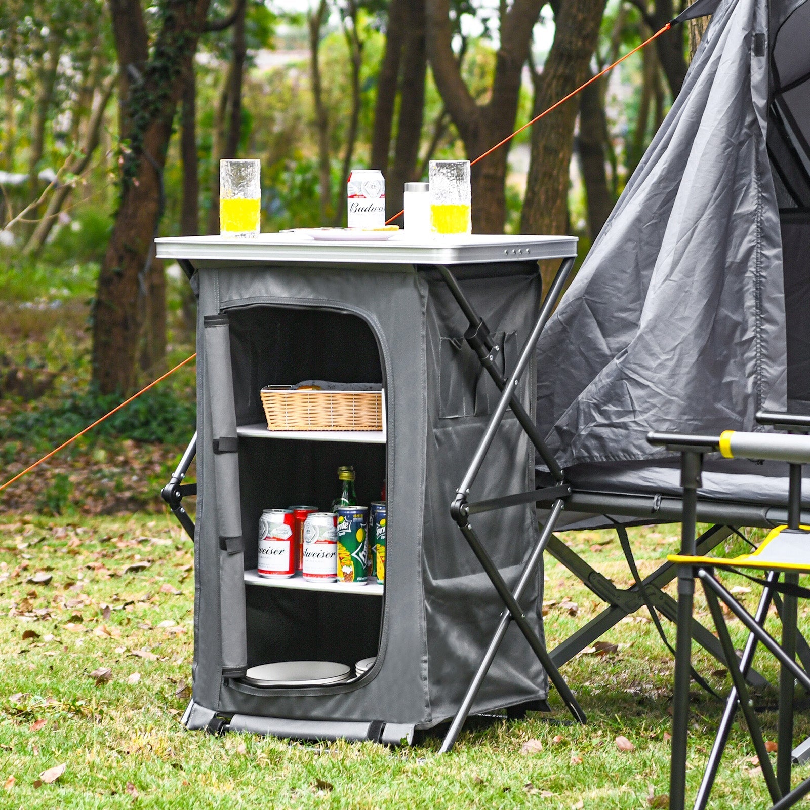 Folding camping storage cabinet with 3 gray fabric shelves and carry bag at campsite on Tampa Home & Garden Store