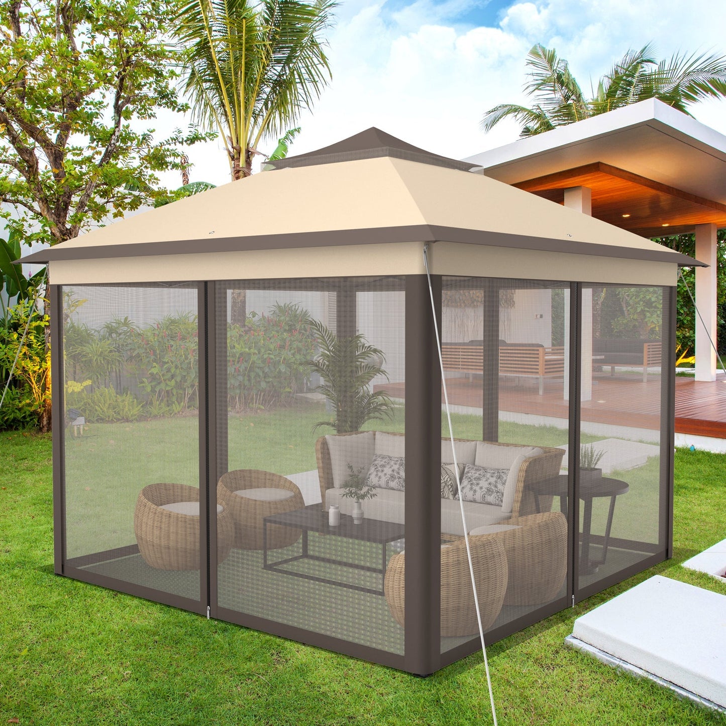 GemGear 11x11 ft two-tier pop-up gazebo with beige canopy and mesh walls in backyard on Tampa Home & Garden Store