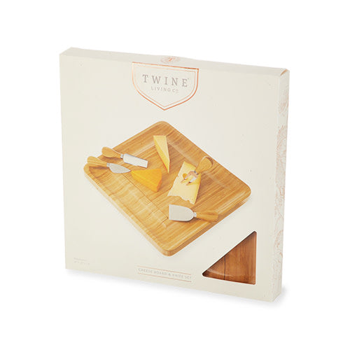 Four-piece bamboo cheese board and knife set by Twine Living on white packaging box on Tampa Home & Garden Store